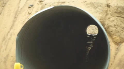 It's raining, the pipe is eco-friendly, the pipe is under the sand Stock Footage 276966005