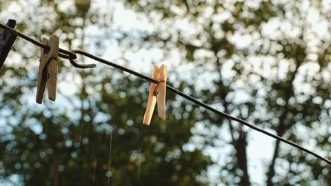 It's raining in summer, a clothespin in the foreground 動画素材 318713598