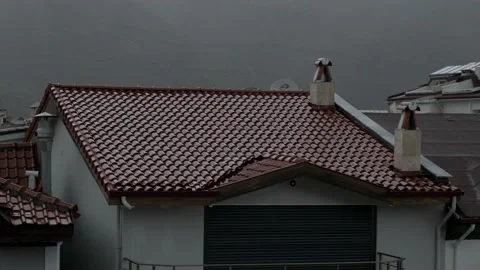It's raining on the tiled roofs Stock Footage 226942981