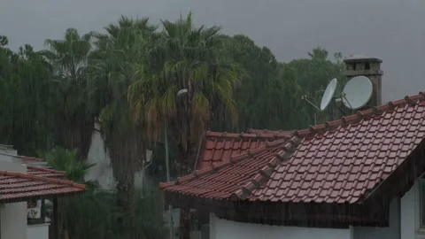 It's raining on the tiled roofs Stock Footage 226943694