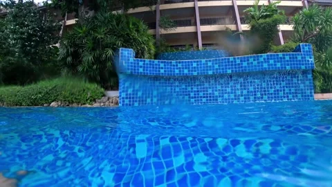 It's raining. The waterfall in the pool is working Video stock 194477241