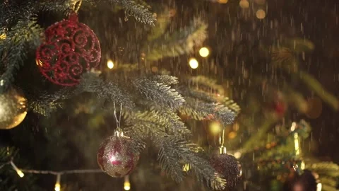 It's snowing an elegant Christmas tree against the background of flashing lights Stock Footage 166017239