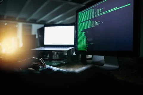 Its a state of the art setup. an unrecognizable computer hacker hacking into a Foto stock