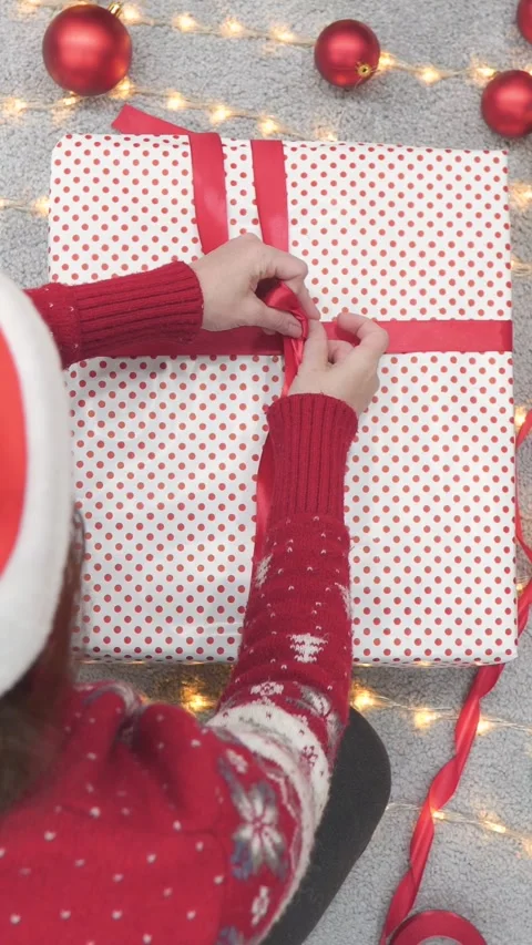 Its time for festive gift wrapping as we celebrate Christmas with cheer Stock Footage 293147707