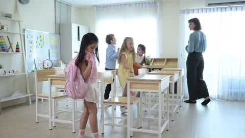 It's time to leave school. The child picked up his bag and went home Stock Footage 285320404