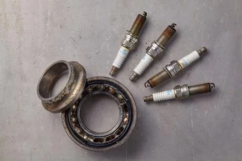 It's time to replace used spark plugs and bearings Stock Photos