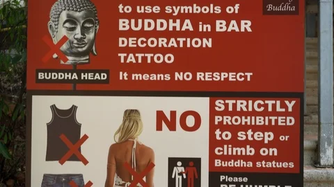 It's wrong to use symbols of BUDDHA in Bar decoration tattoo. It means no respec Stock Footage 124234672