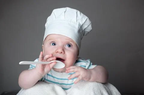 Ittle boy in a chef hat Stock Photos