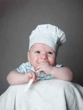 Ittle boy in a chef hat Stock Photos