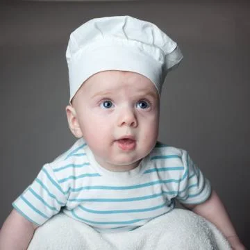 Ittle boy in a chef hat Stock Photos