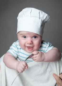 Ittle boy in a chef hat Stock Photos