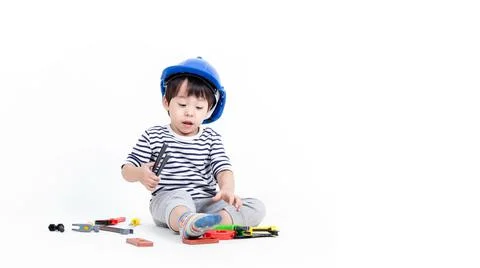 Ittle boy playing act engineer, education concept. Stock Photos
