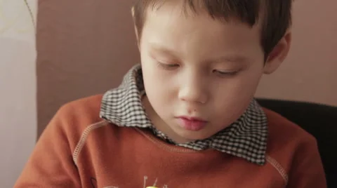 Ittle boy playing a game on your smartphone Stock Footage 59177643