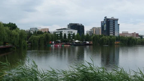 Iulius Mall Lake view surrounded by  modern buildings in the background Stock Footage 113597468