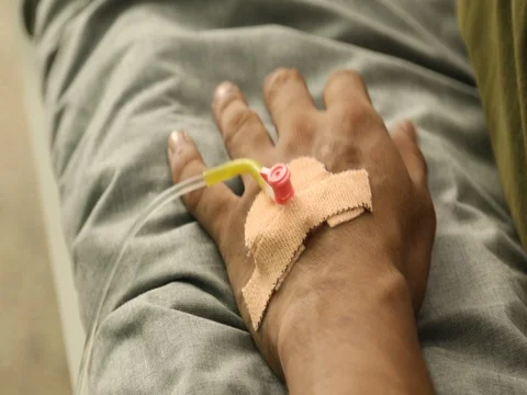 Iv drip in patient's hand Stock Footage 83782988