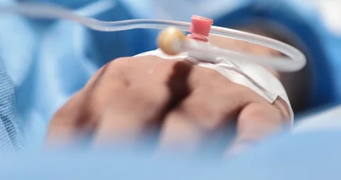 Iv drip in patient's hand Stock Footage 118084257