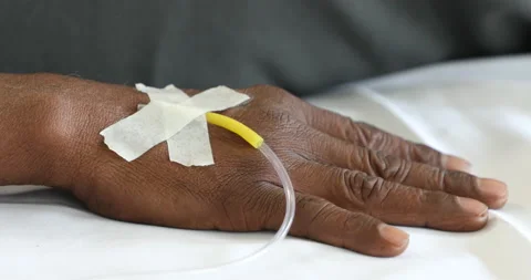 Iv drip in patient's hand Stock Footage 146290963