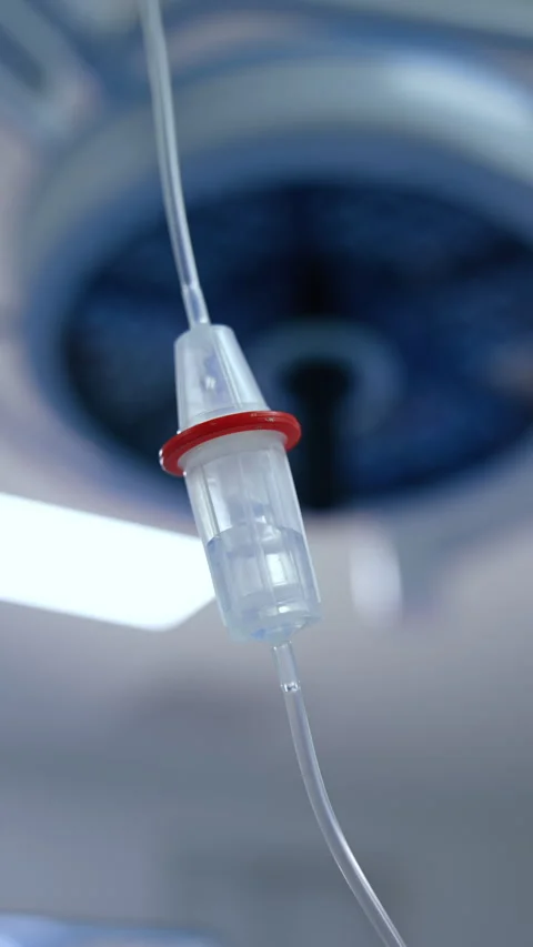 Iv drip reservoir with saline solution dripping inside.  Stock Footage 288723216