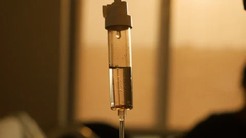 Iv dripping quickly with sunset in the background Stock-Footage 93665880