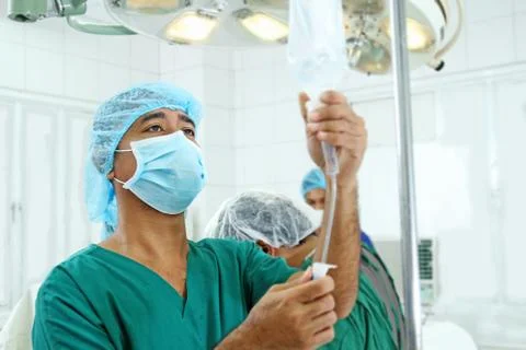 Iv fluids in the operating room Stock Photos