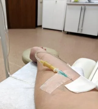 IV needle in arm Foto stock