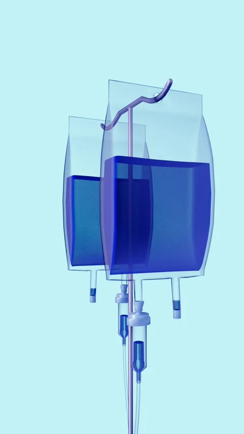 The IV pole and two bags of deep blue methylene blue spin Stock Footage 339167650