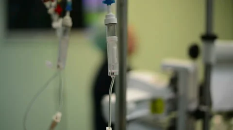 Iv solution with doctor on background preparing tools for surgery Vídeo Stock 45294887