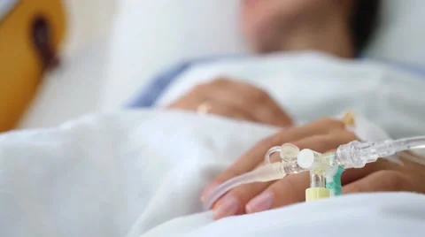 IV Solution in a Patients Hand. Focus on Hand Stock Footage 61572660