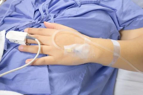 Iv solution in a patients Stock Photos