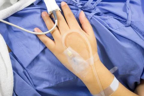 Iv solution in a patients Stock Photos