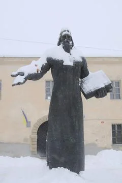Ivan Fedorov statue covered in winter snow in the city of Lviv Ukraine Stock Photos