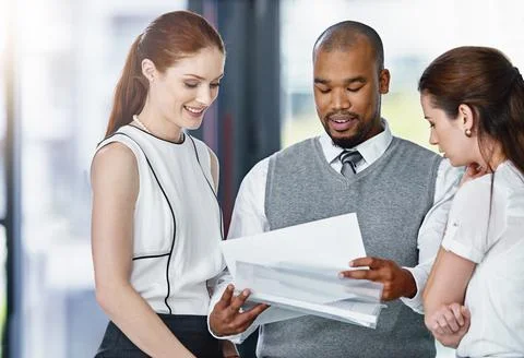 Ive drafted up a new document...a group of businesspeople looking through some 스톡 사진