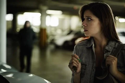 Ive got to get away from here. A terrified young woman in an underground parking Fotos de archivo