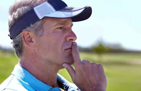 Ive only got three shots left for par...Profile of a mature male golfer busy Stock Photos