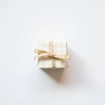 Ivory check pattern gift box isolated on white background. top view Ivory ... Stock Photos