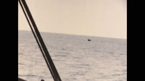 Ivory coast 1950s, Daytime view of four people riding boat in ocean Stock Footage 233529248
