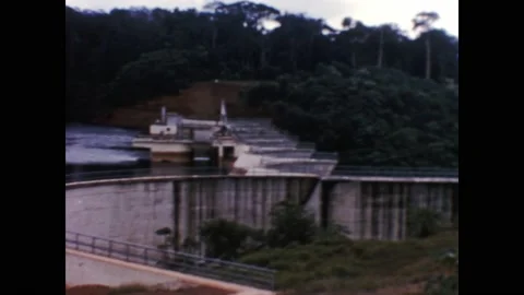 Ivory coast 1950s, Daytime view of Ayame Dam with green trees Stock Footage 233547403
