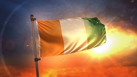 Ivory Coast Flag Backlit At Beautiful Sunrise Loop Slow Motion 4K Stock Footage 76315827