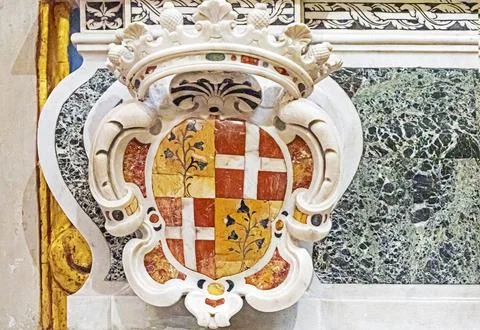 Ivory decorative elements with a crown on a knight's shield Stock Photos