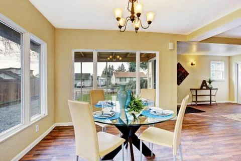 Ivory dining area with served table Stock Photos