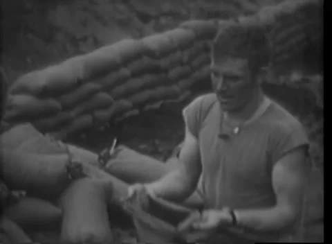 IWO JIMA - 1945: Beachhead — Serviceman works at a makeshift field surface Stock Footage 342981273