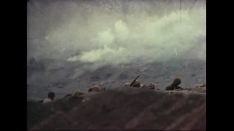 IWO JIMA - 1945: Captures the congested beachhead as men and boats crowd the 스톡 동영상 339214999