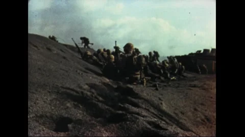 IWO JIMA - 1945: Captures the infantry push up the beach terraces Stock Footage 339214997
