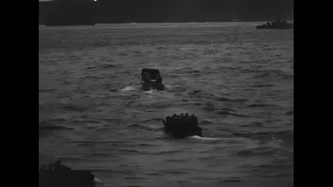 IWO JIMA - 1945 - Two small landing craft, LCVP heading toward beach. Dive Stock Footage 312790577