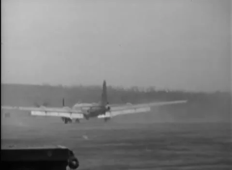 IWO JIMA, JAPAN - 1945: Distant bomber - B-29 rolls across hazy runway Stock Footage 344503540