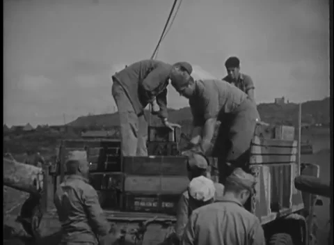 IWO JIMA, JAPAN - 1945: Loading crew - Marines pack crowded supply truck Stock Footage 344503098