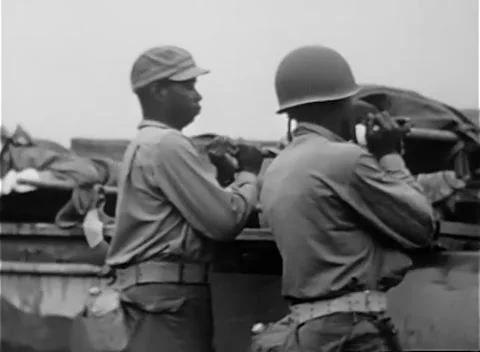 IWO JIMA, JAPAN - 1945: Loading - Loaded litter raised toward waiting jeep Stock Footage 344504217