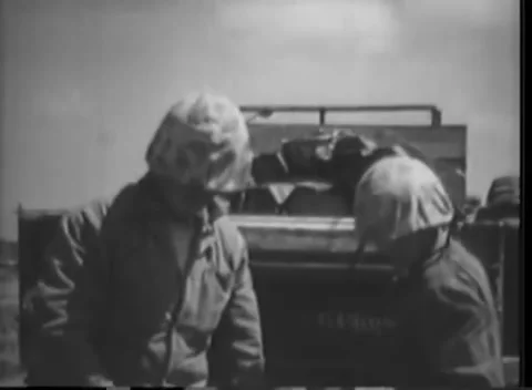 IWO JIMA, JAPAN - 1945: Loading detail - Helmeted men stand beside a tailgate Stock Footage 344505596