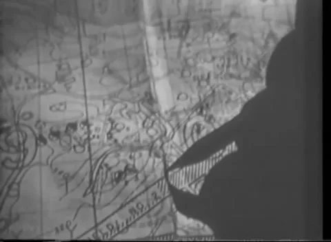 IWO JIMA, JAPAN - 1945: Map study - Shadow falls across a contour map Stock Footage 344503041