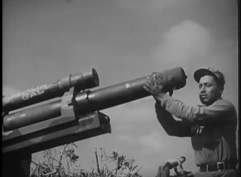 IWO JIMA, JAPAN - 1945: Muzzle maintenance - Marine works at howitzer muzzle Видео 344503129